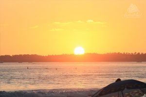 Sunset at the beach and umbrella