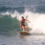Woman surfing waves in the Pacific