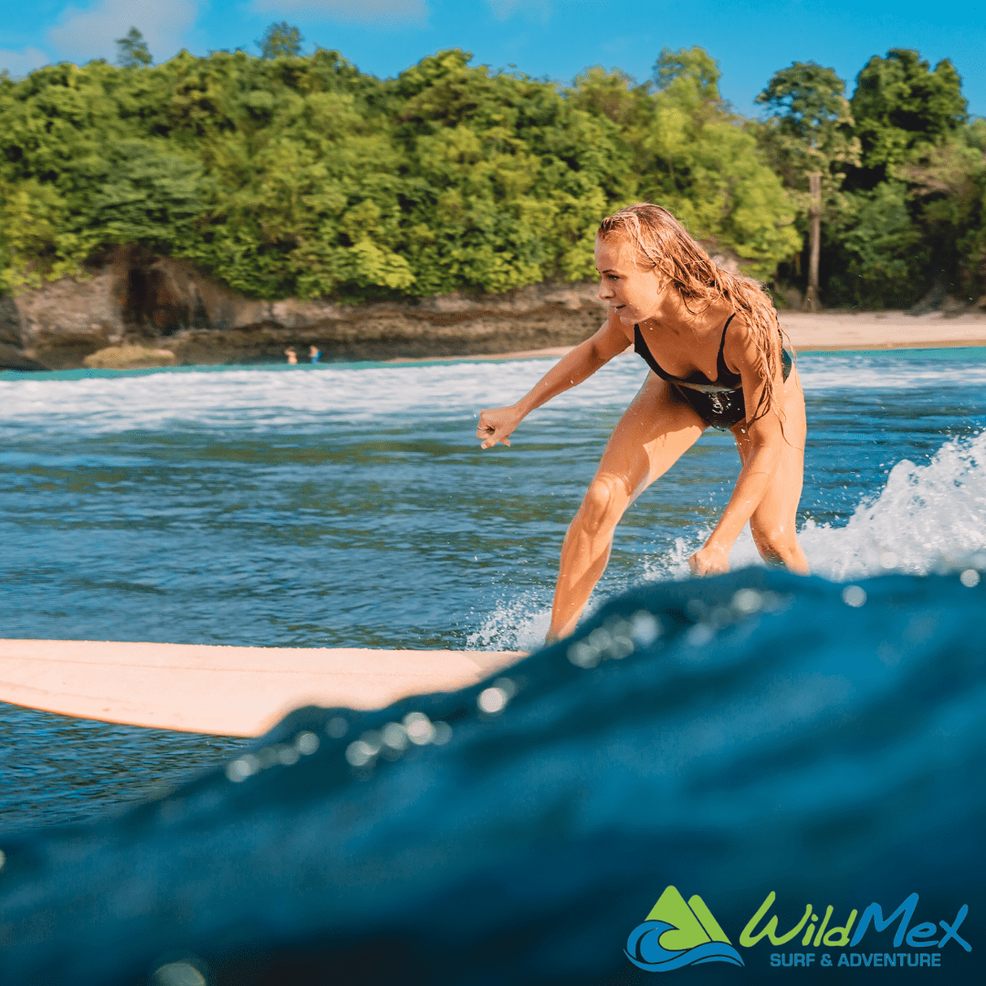 Girl surfing in longboard