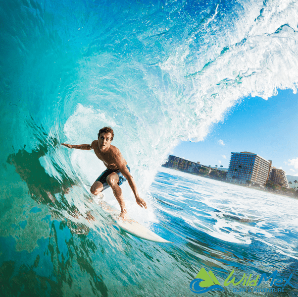 Surfer getting barreled in a big wave