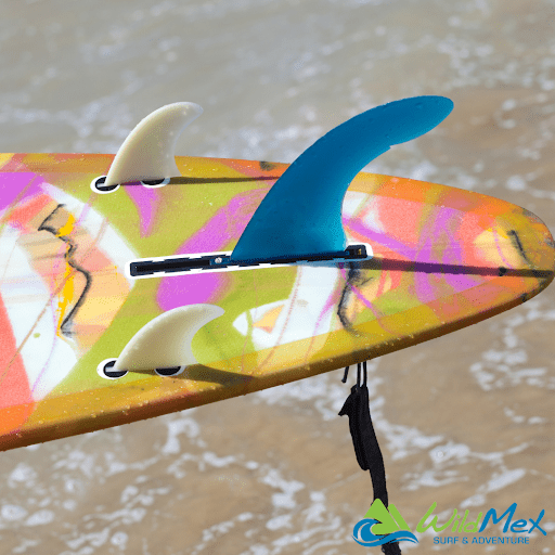 Learning to surf in Mexico starts with setting up your 2+1 fin board