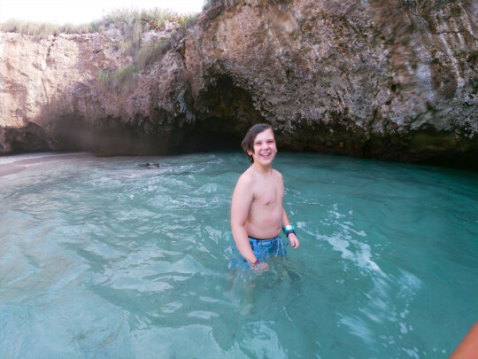 Smiling child enjoying Hidden Beach during a Marietas Islands tour