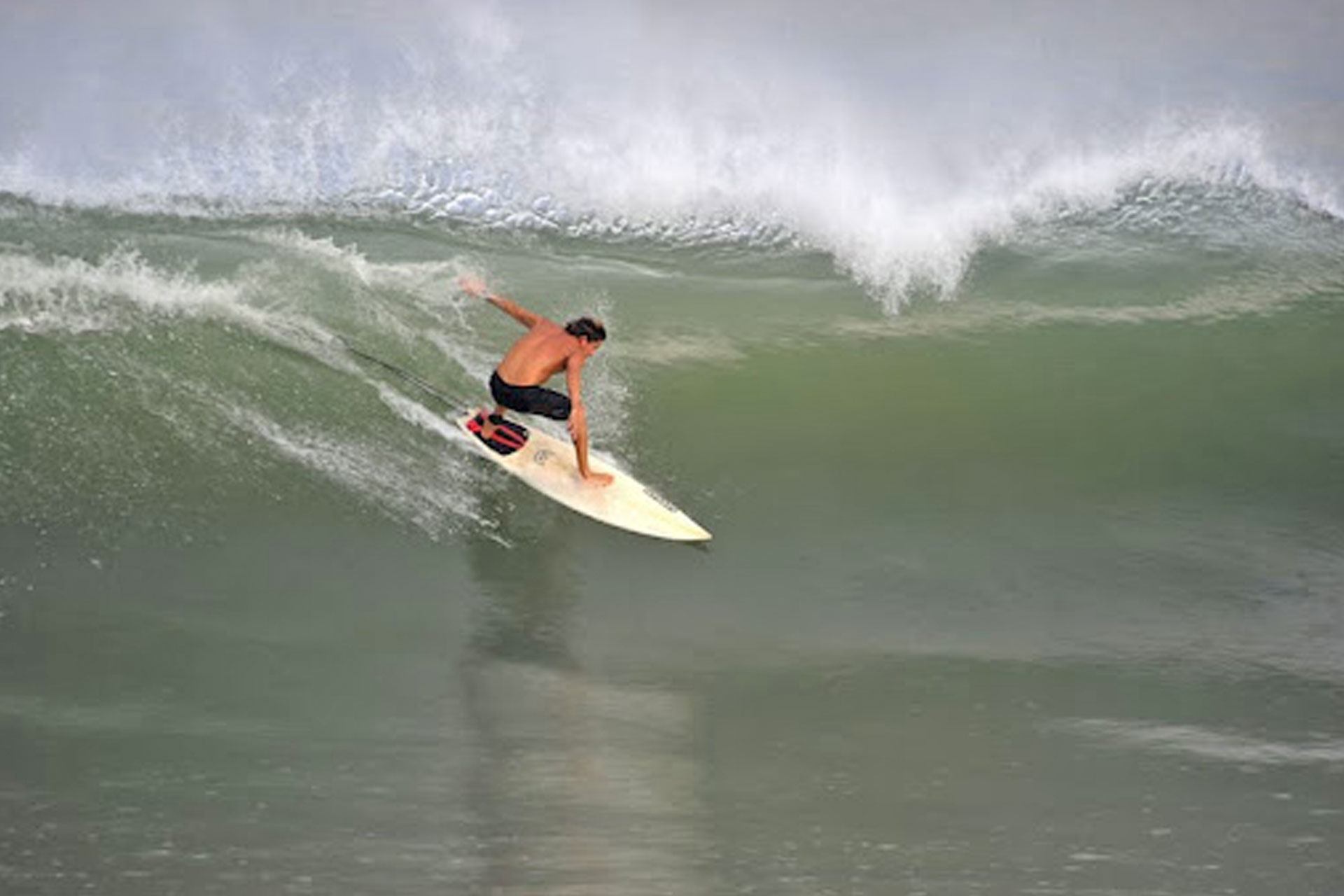 Surfer tackling big waves at Playa San Pancho
