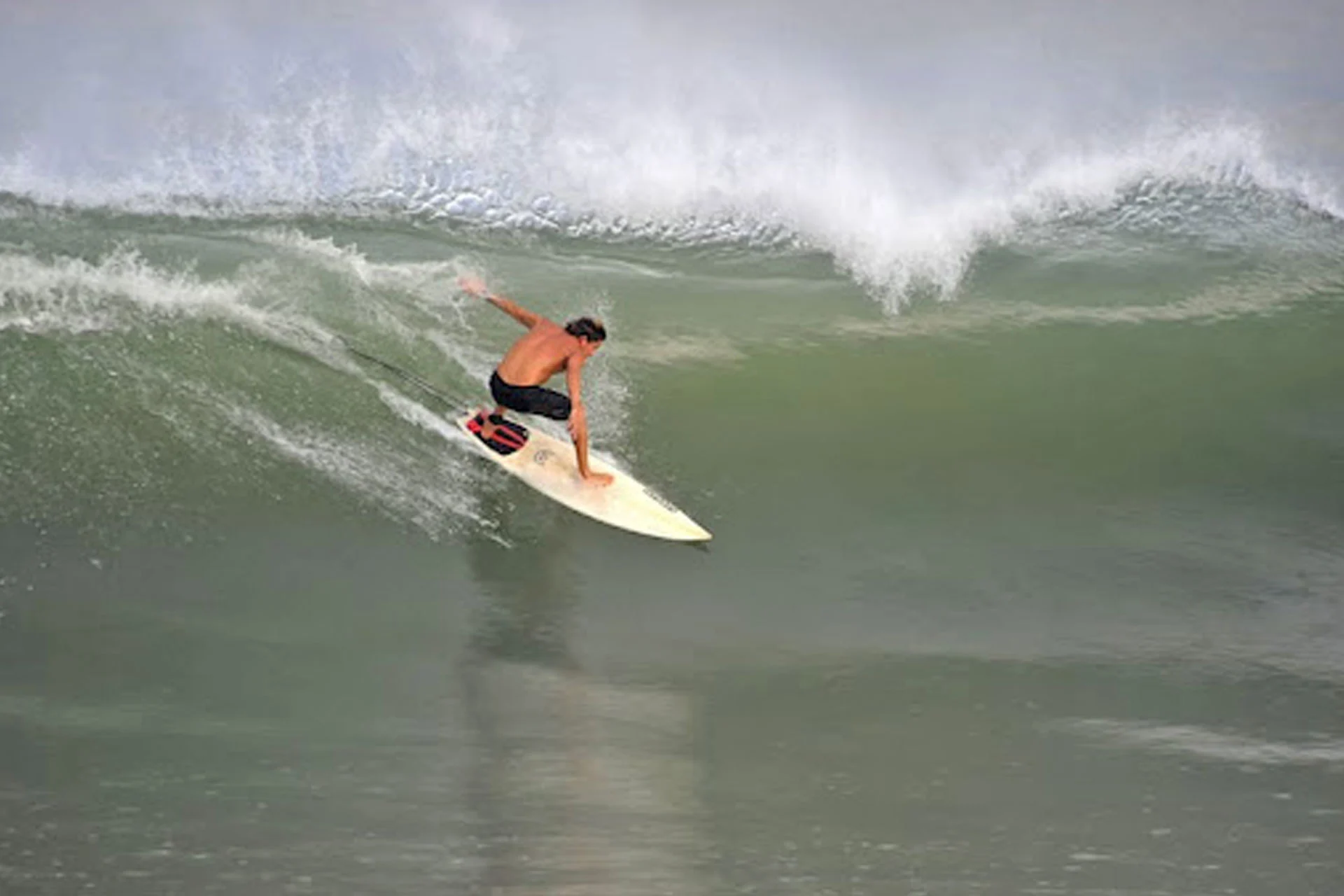 Surfer tackling big waves at Playa San Pancho