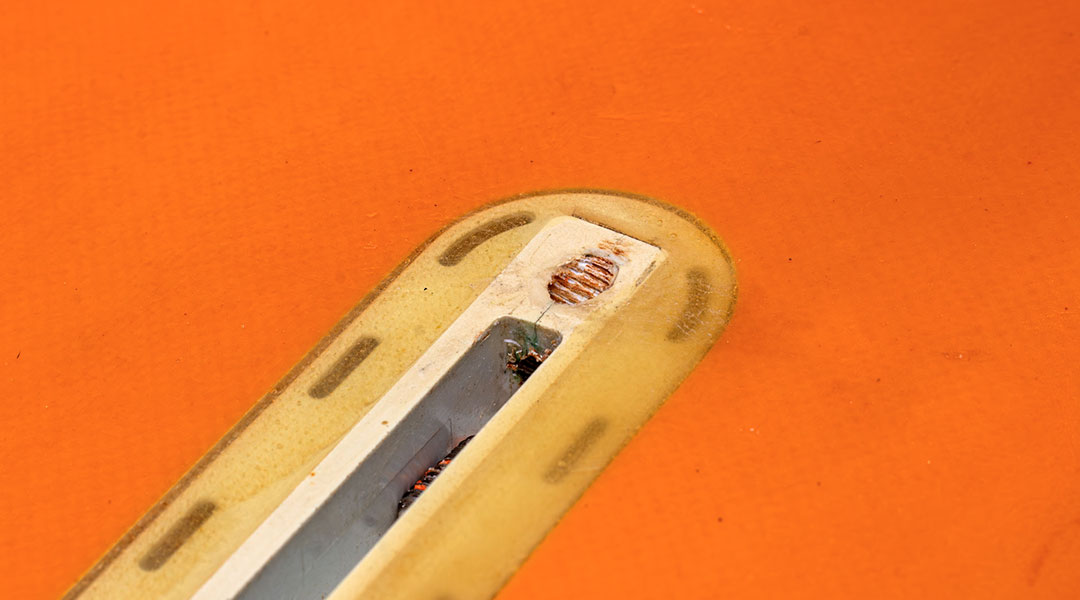 Surfboard fin box damaged by incorrect screw use