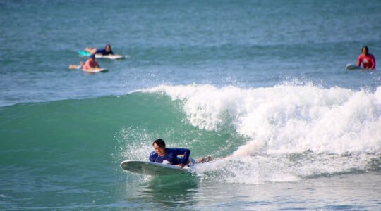 Surfer preparing to catch a wave at La Lancha beach