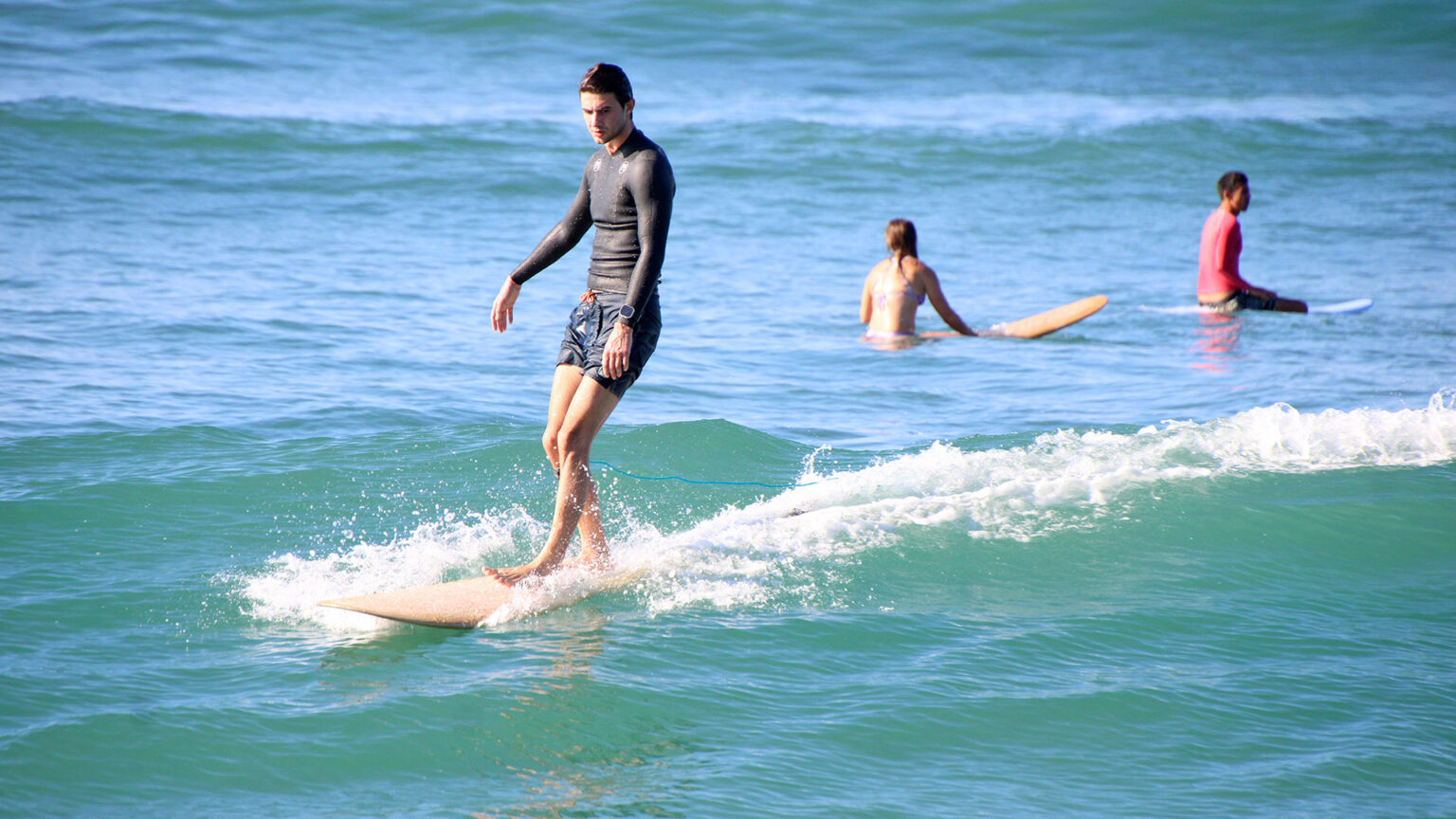 Surfer riding a wave during WildMex surf camp in Punta Mita