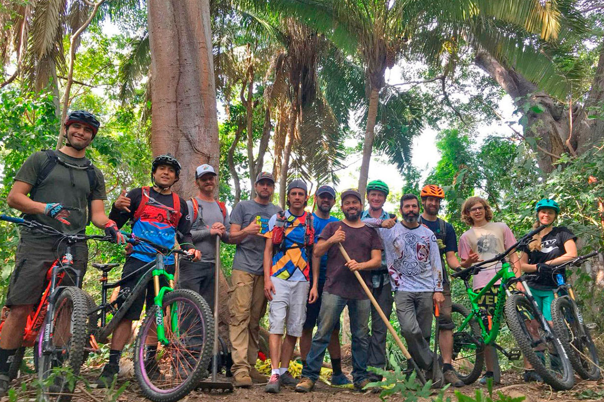 WildMex guides and visitors together at a trailhead after trail work