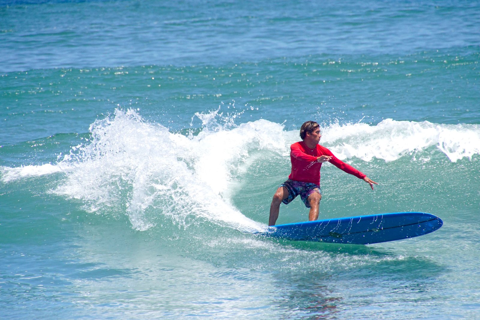 Experienced shortboarder taking off on a steep left wave at Sayulita main peak